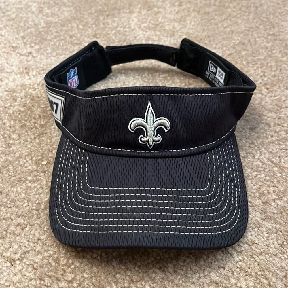 New Orleans Saints sun visor hat.